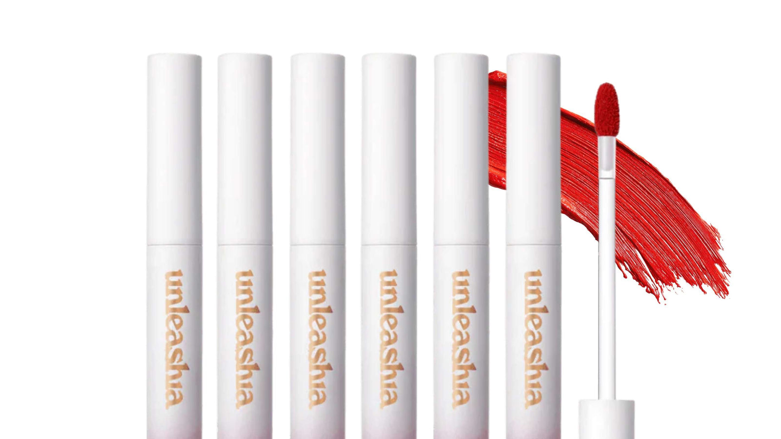 Bilden visar en samling av Peripera Ink The Velvet läppfärger i olika röda och rosa nyanser, med deras karaktäristiska dropp-applikatorer. Dessa produkter är kända för sin intensiva pigmentering och långvariga, sammetsmjuka finish.