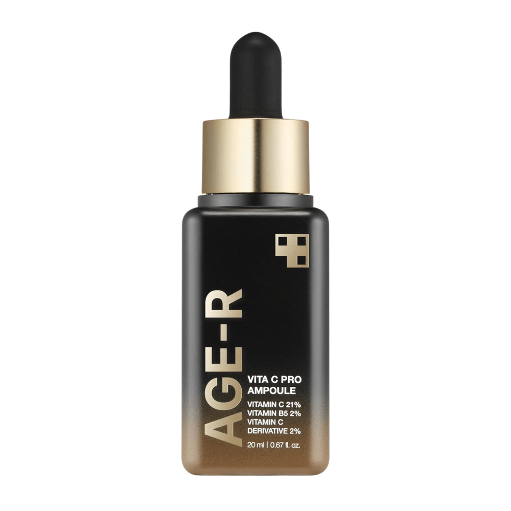 Bottle of Medicube Age-R Vita C Pro Ampoule, a product that contains 21% vitamin C, 2% vitamin B5, and 2% vitamin C derivative. The black and gold packaging features a dropper for precise application. The product is designed to brighten and improve skin texture.