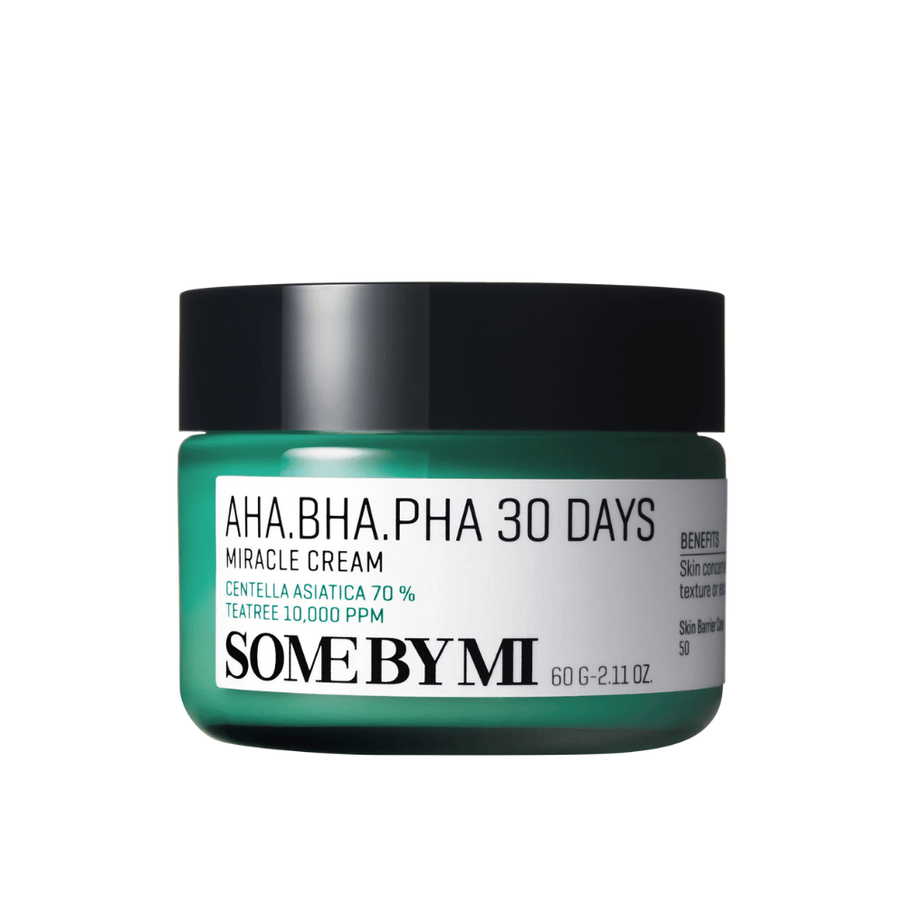 A jar of "SOME BY MI AHA, BHA, PHA 30 Days Miracle Cream". This face cream contains 70% centella asiatica and 10,000 PPM tea tree oil, intended to soothe and hydrate the skin while combating skin issues like acne. The jar is designed in a distinctive green color with a black lid.