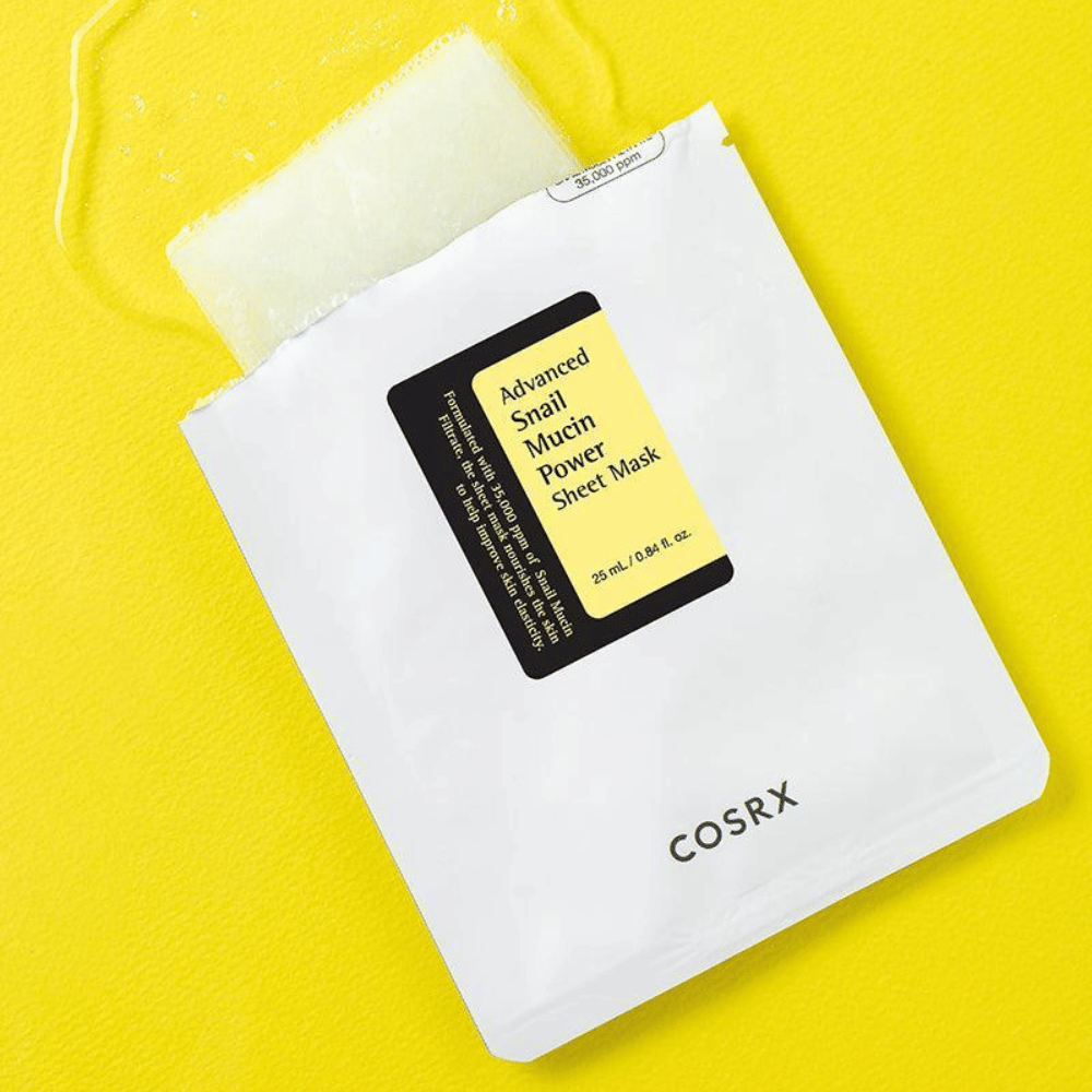 COSRX Advanced Snail Mucin Power Sheet Mask on yellow background, a moisturizing and repairing face mask with snail secretion for increased elasticity and radiance.