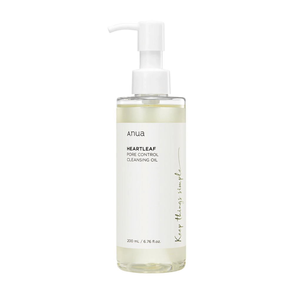 The image shows ANUA Heartleaf Pore Control Cleansing Oil, a skincare product intended for facial cleansing. The bottle is transparent, and the label has a minimalist design, giving a clean and natural feel. It contains 200 ml / 6.76 fl.oz. and has a practical pump for easy dosing.