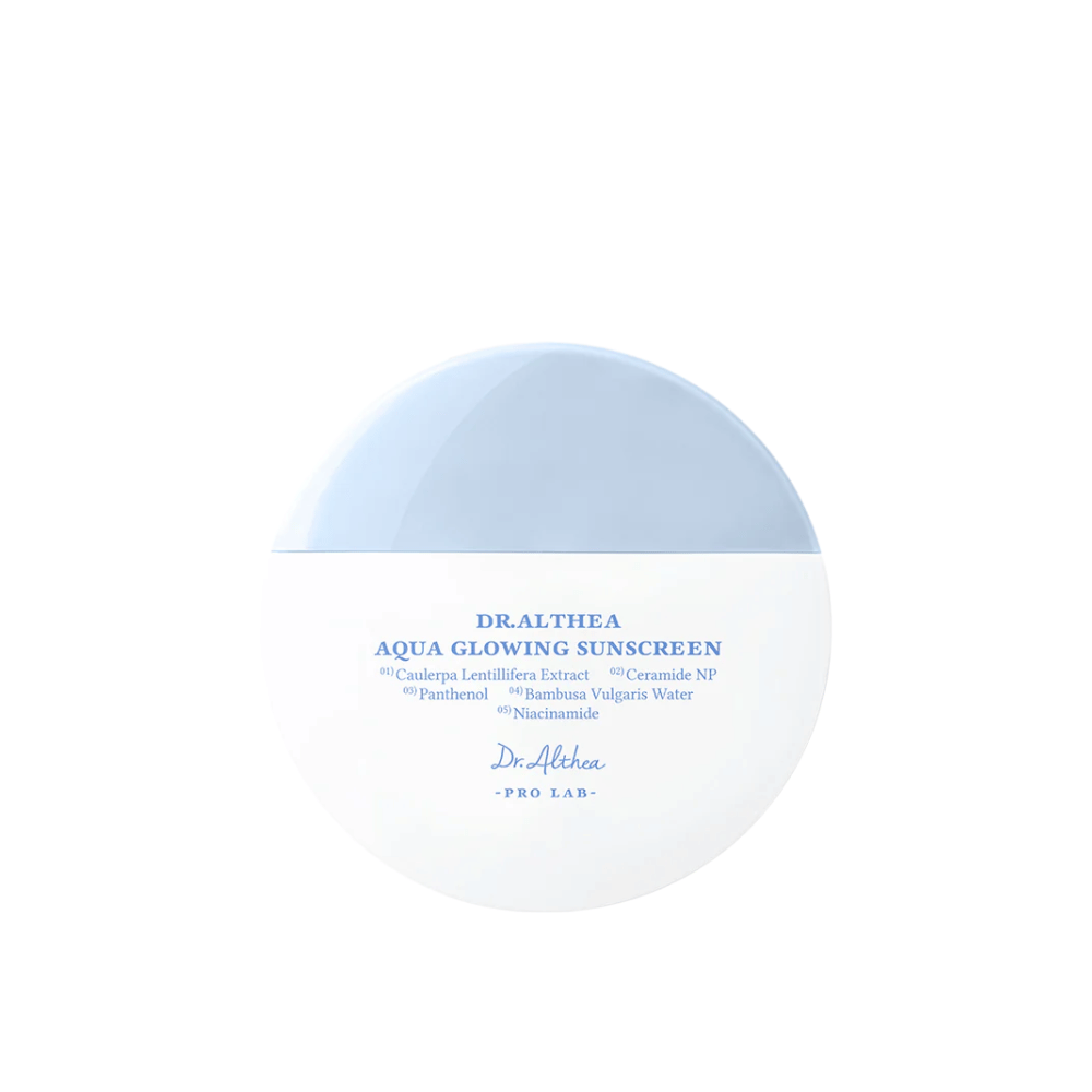 Product image of Dr. Althea Aqua Glowing Sunscreen – a round sunscreen in white and light blue packaging with blue text highlighting moisturizing ingredients like niacinamide and ceramides.
