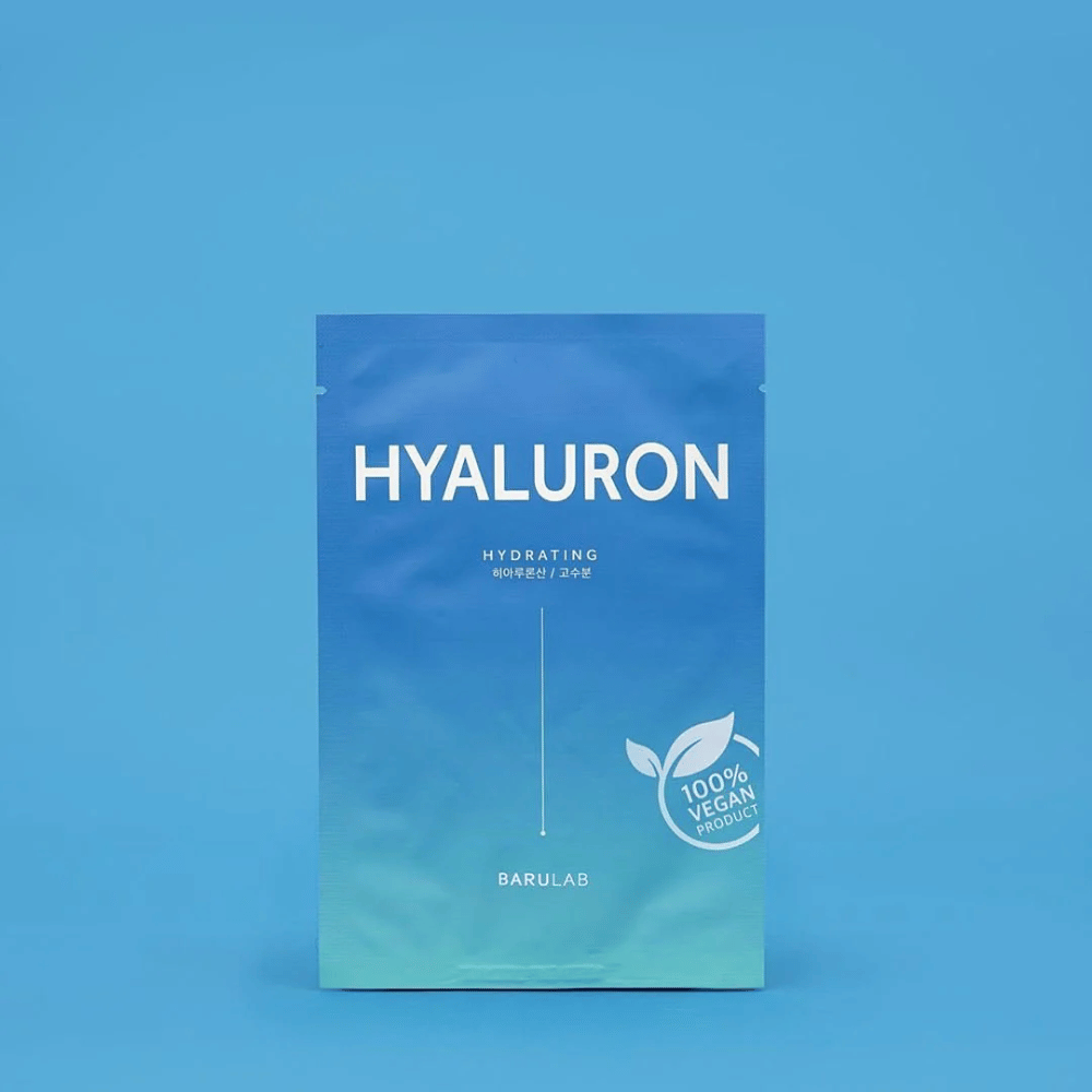 A package of BARULAB "HYALURON Hydrating" mask, labeled as "100% Vegan Product", in front of a uniform blue background. The package has a color gradient from dark blue to light blue.