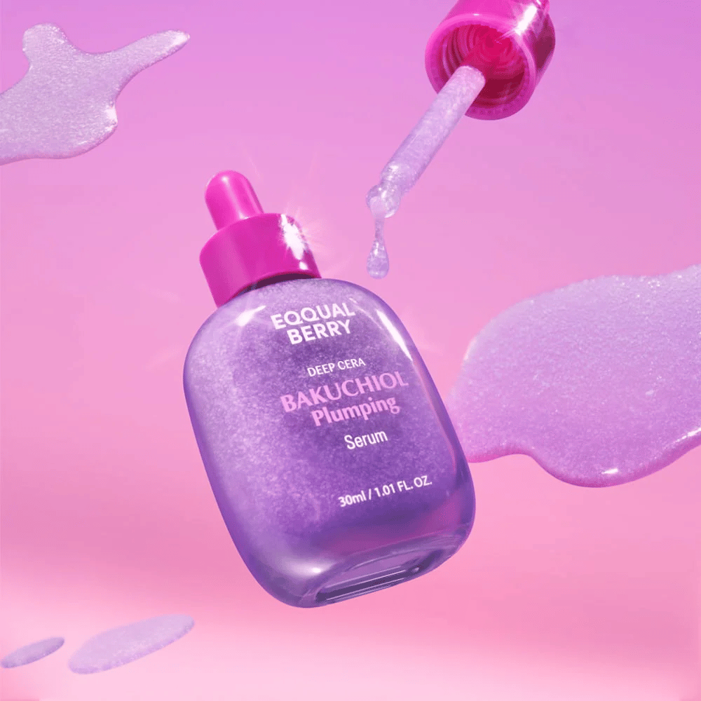 Equal Berry Bakuchiol Plumping Serum in a purple shimmering bottle with a pink pipette. Serum drops and background in soft pink tones for a luxurious feel.