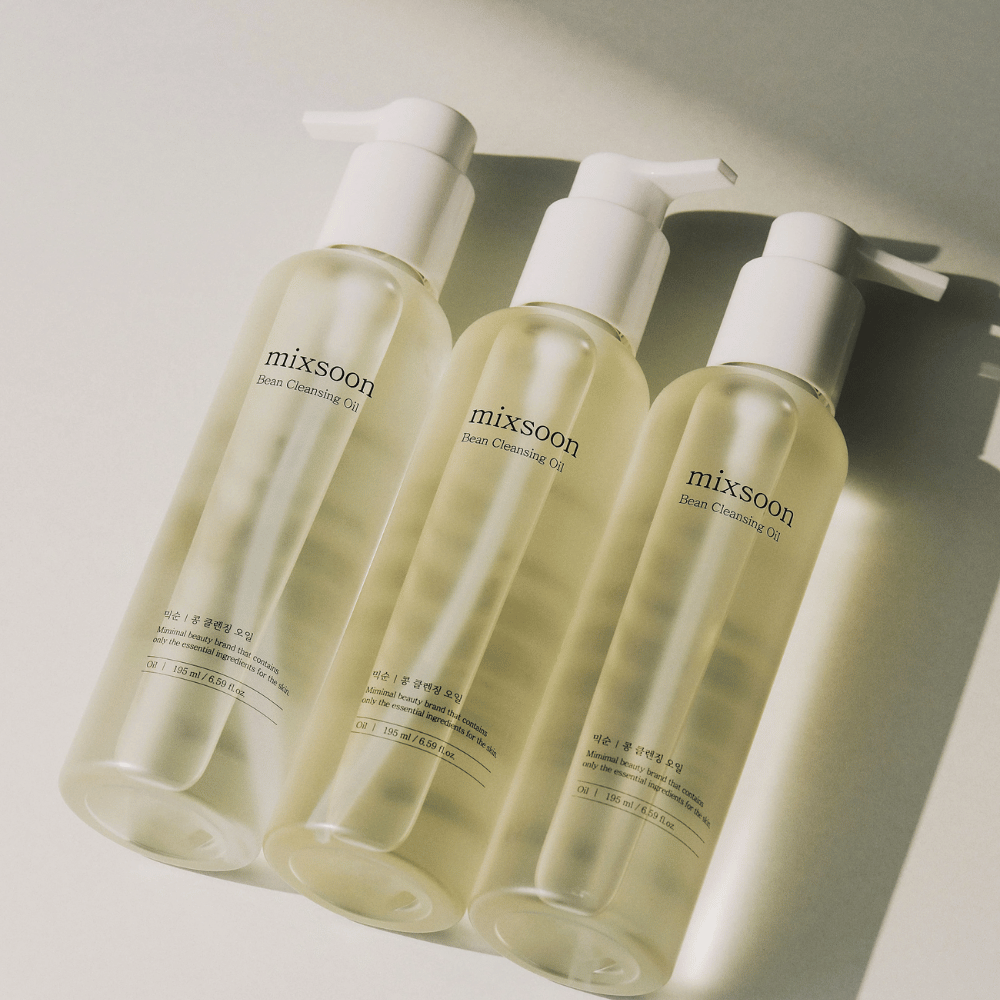 Three bottles of Mixsoon Bean Cleansing Oil – a Korean oil-based cleanser that gently removes makeup, impurities, and moisturizes the skin.