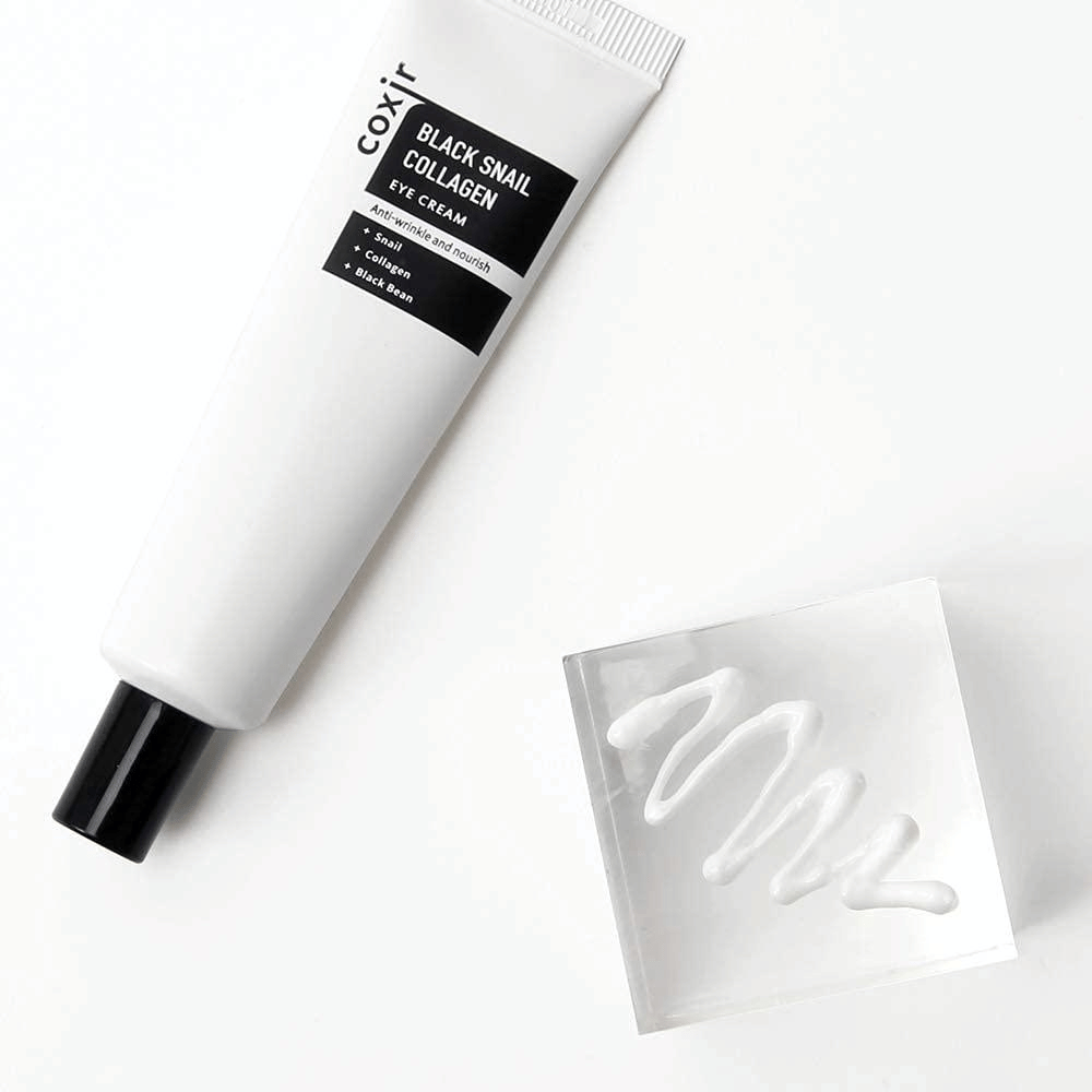 This is an image of "Black Snail Collagen Eye Cream". It is an eye cream containing ingredients like snail extract and collagen, known for their moisturizing and nourishing properties. The product is marketed to provide skin elasticity and nourishment.
