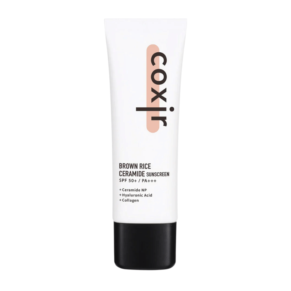 Product image of Coxir Brown Rice Ceramide Sunscreen in white tube with black cap, SPF 50+ PA+++, contains ceramides, hyaluronic acid, and collagen.