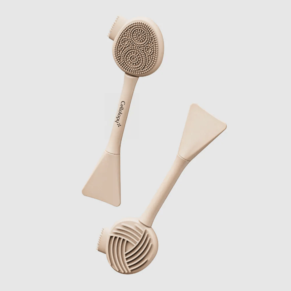 2. Cellolopy Cleaning Brush – front and back of a multifunctional cleansing brush with silicone bristles, ribbed surface, and spatula