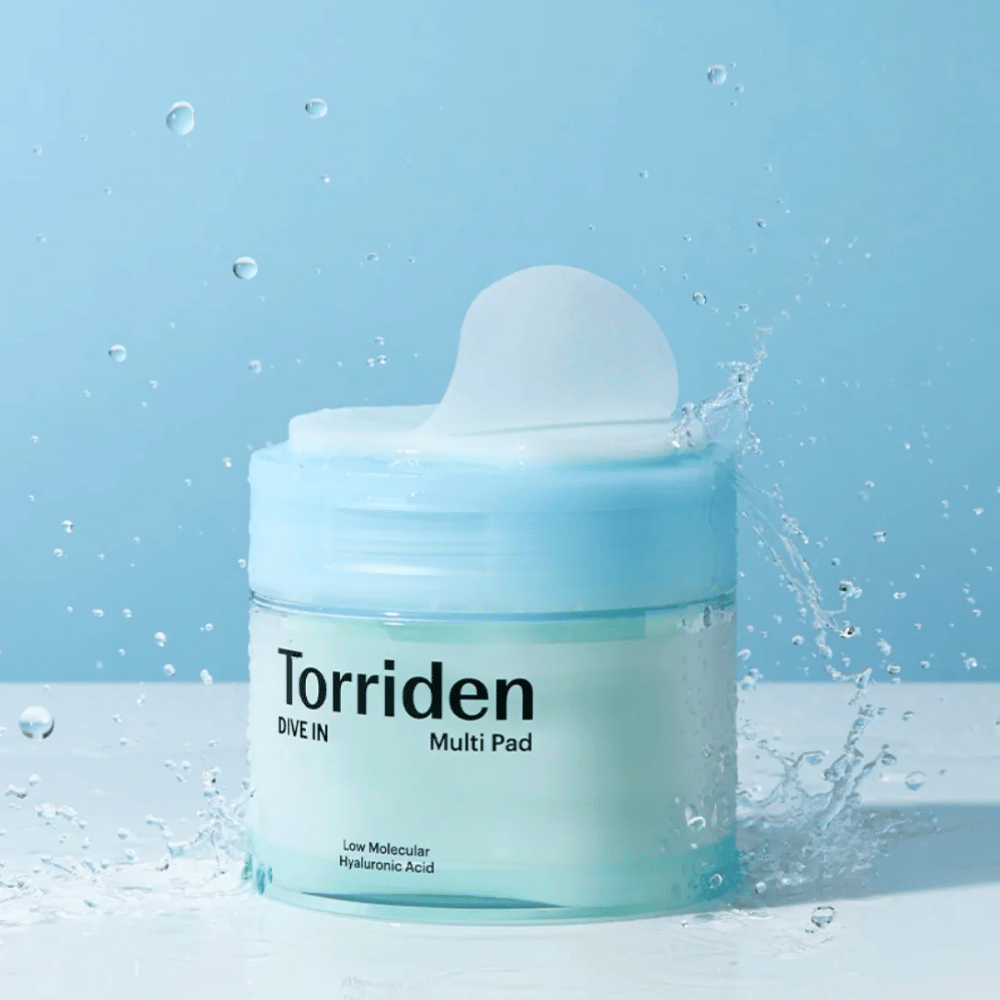 Torriden "DIVE IN Multi Pad" with water droplets in the air against a blue background.