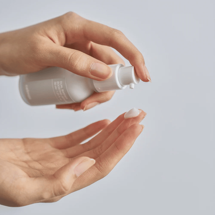 Celimax Dual Barrier Boosting Serum pumped out into the hand, light serum texture for daily skincare and barrier repair.