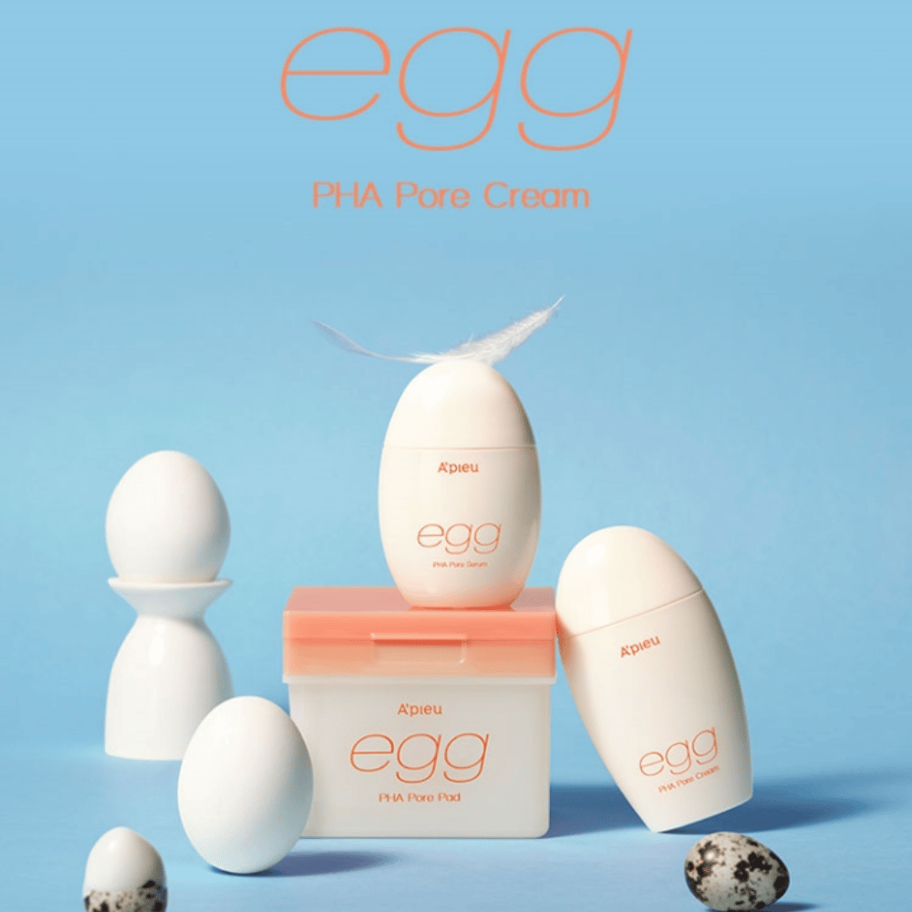 A'pieu Egg PHA Pore series – egg-shaped products like serum, cream, and pads, stylishly arranged on a blue background with eggs and feathers symbolizing gentle skincare.