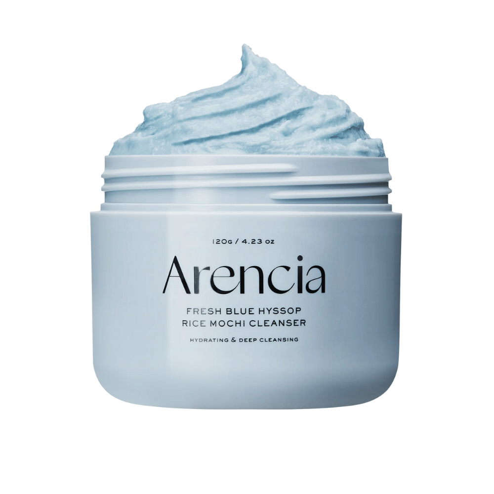 Close-up of an open jar Arencia Fresh Blue Hyssop Rice Mochi Cleanser. The blue cleansing cream has an airy, whipped texture and fills the top of the jar.