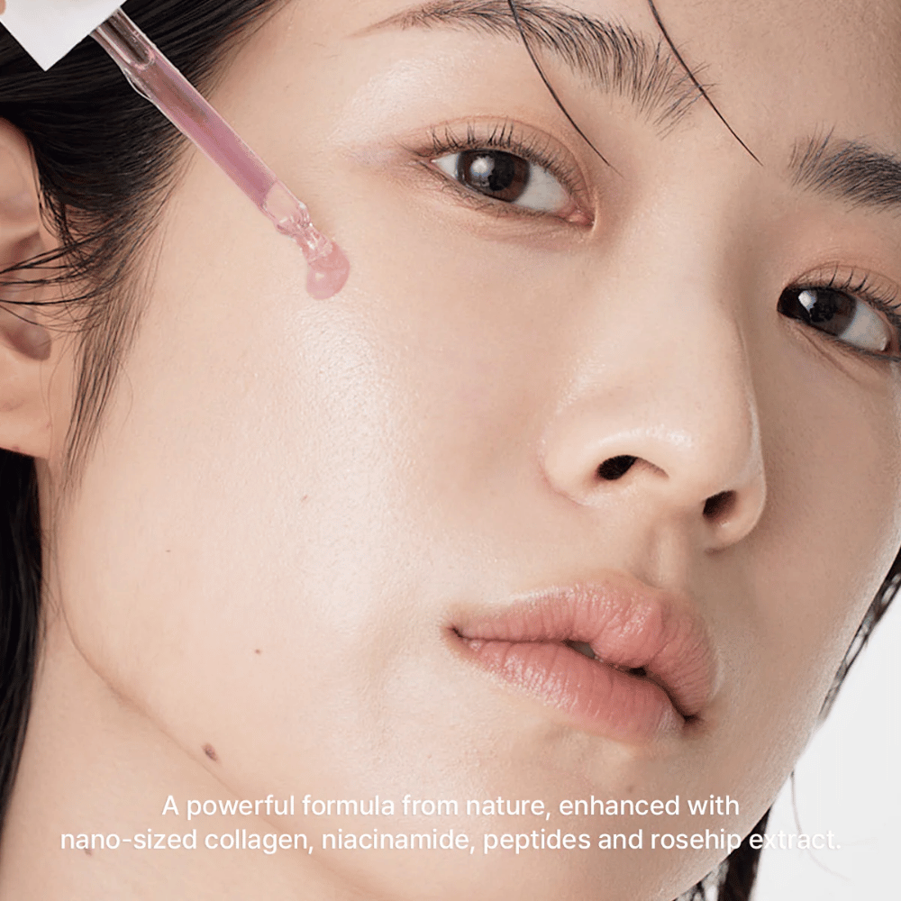 Close-up of a face where Arencia Red Smoothie Serum 8 is applied with a dropper. The serum has a light pink tone and contains nano-collagen, niacinamide, peptides, and rosehip extract.
