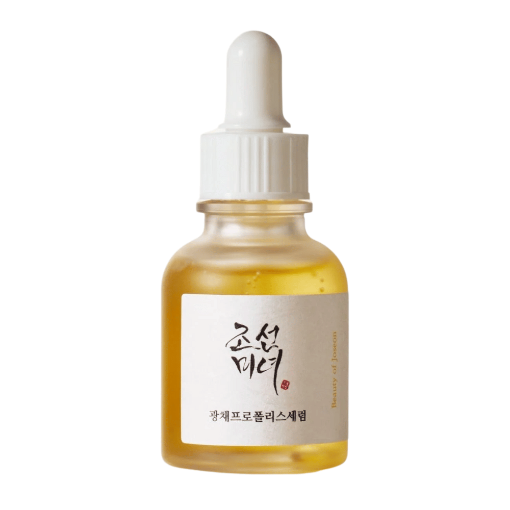 Bottle of Beauty of Joseon Glow Serum with white pipette and gold-colored serum, a radiance-giving product with propolis and niacinamide.