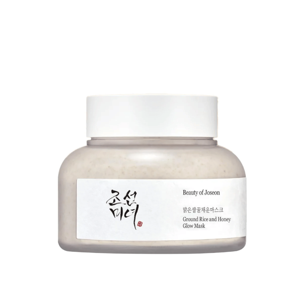 A jar "Beauty of Joseon Ground Rice and Honey Glow Mask". The packaging is simple with a white cap and a label presenting the product name and ingredients in both Korean and English. The product is designed to give radiance and nourishment to the skin.