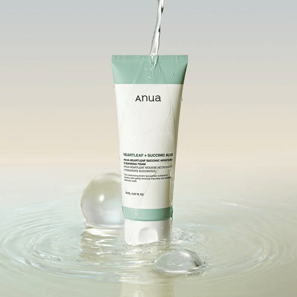 Product image where the cleanser is surrounded by running water and water droplets. The image communicates a fresh, moisturizing, and gentle cleansing experience with a focus on purity and hydration.