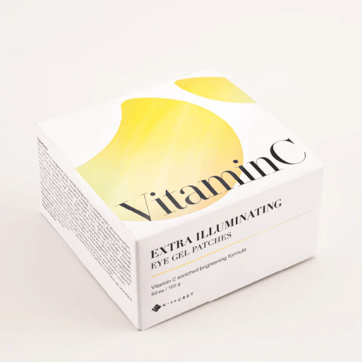 Förpackning av K-Secret Extra Illuminating Eye Gel Patches med vitamin C i vit och gul design.