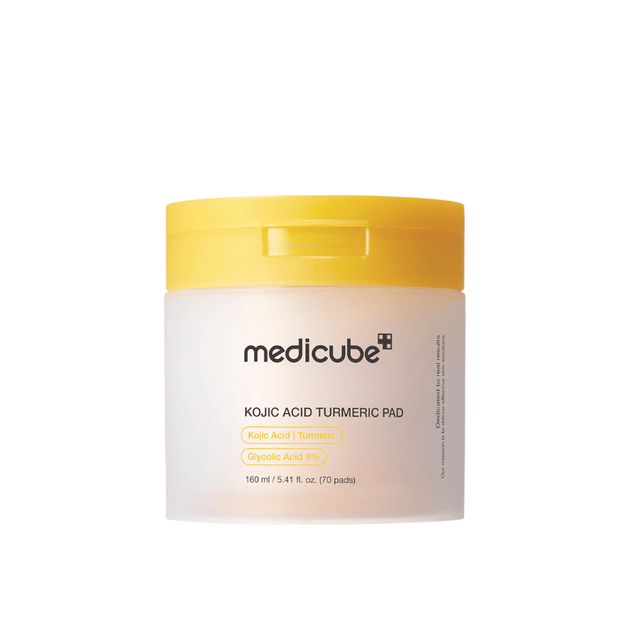Cutout product image of Medicube Kojic Acid Turmeric Pad in a yellow jar with exfoliating pads containing kojic acid, turmeric, and glycolic acid for a more even skin tone and glow.