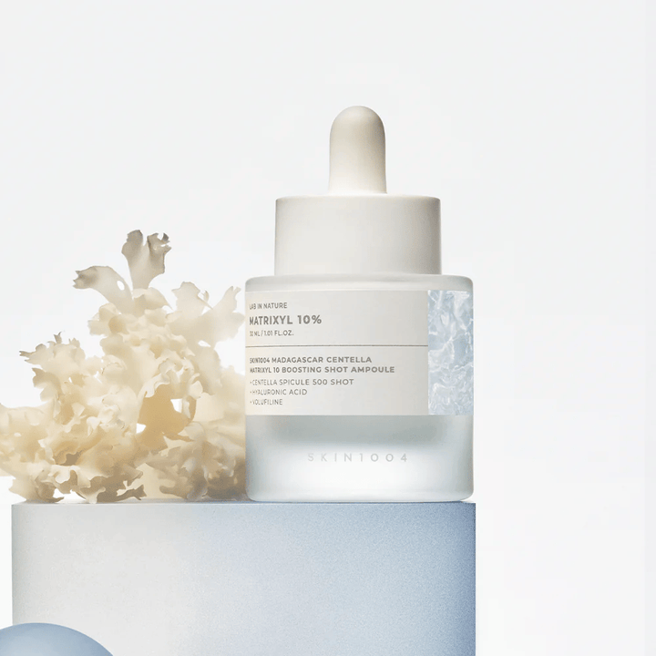 SKIN1004 Madagascar Centella Matrixyl 10 Boosting Shot Ampoule in lifestyle image – anti-age serum with peptides and centella that strengthens the skin barrier and provides resilience.
