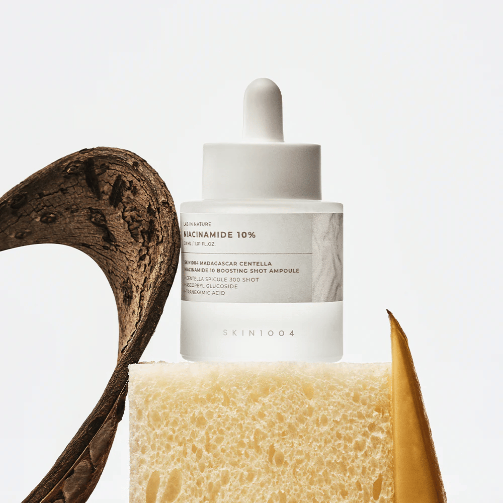 SKIN1004 Madagascar Centella Niacinamide 10 Boosting Shot Ampoule in lifestyle image – facial serum that helps reduce uneven skin tone and strengthen the skin barrier.