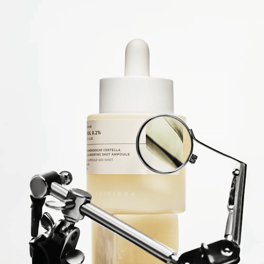 Detail image of SKIN1004 Madagascar Centella Retinol 0.2 Boosting Shot Ampoule highlighting the active formula with retinol, centella spicule, and squalane for effective skin renewal.