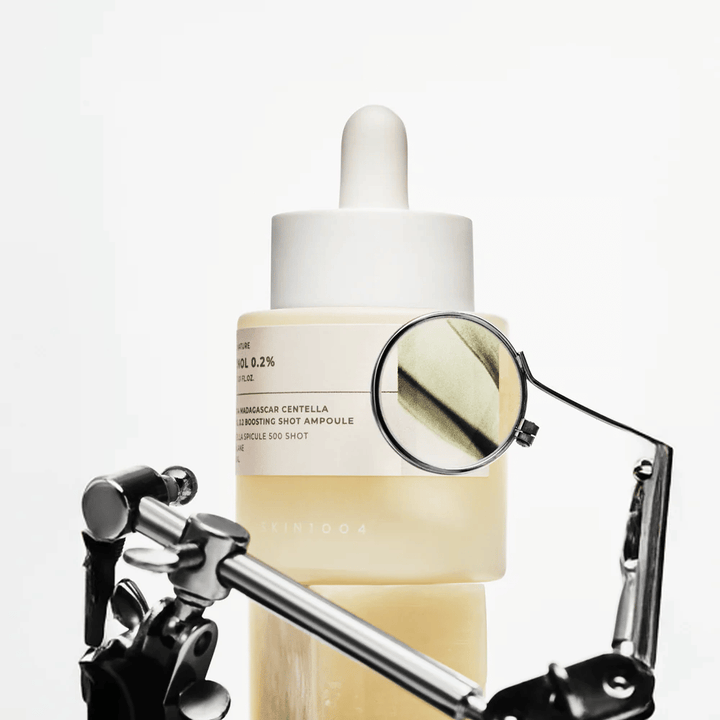 Detail image of SKIN1004 Madagascar Centella Retinol 0.2 Boosting Shot Ampoule highlighting the active formula with retinol, centella spicule, and squalane for effective skin renewal.
