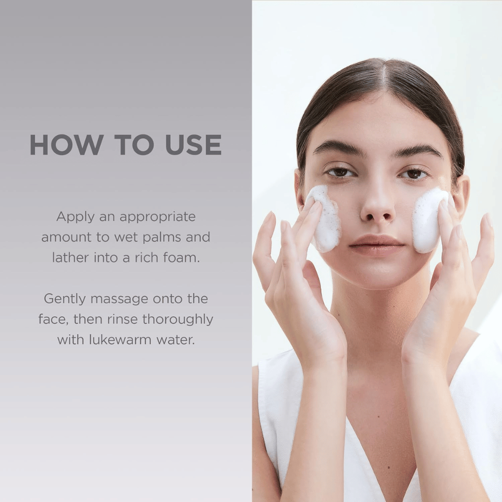 Instructional image with a model showing how the product is used. The focus is on application to the face and how the cleanser is integrated into the daily skincare routine.