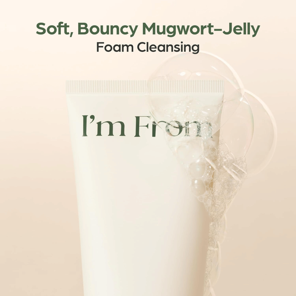 I'm From Mugwort Gel Cleanser with a soft gel texture that forms cleansing foam. Close-up of a beige tube with transparent foam bubbles.