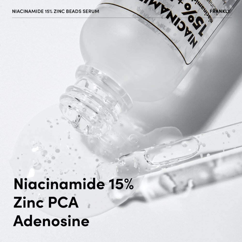 Close-up of FRANKLY Niacinamide 15% + Zinc Beads Serum being poured out. Text shows ingredients: Niacinamide 15%, Zinc PCA, and Adenosine.