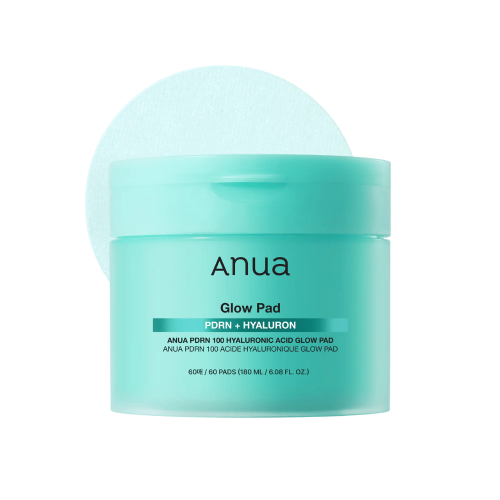 Anua PDRN 100 Hyaluronic Acid Glow Pad in turquoise packaging with lifted pad – moisturizing toner pads for daily hydration and glow.