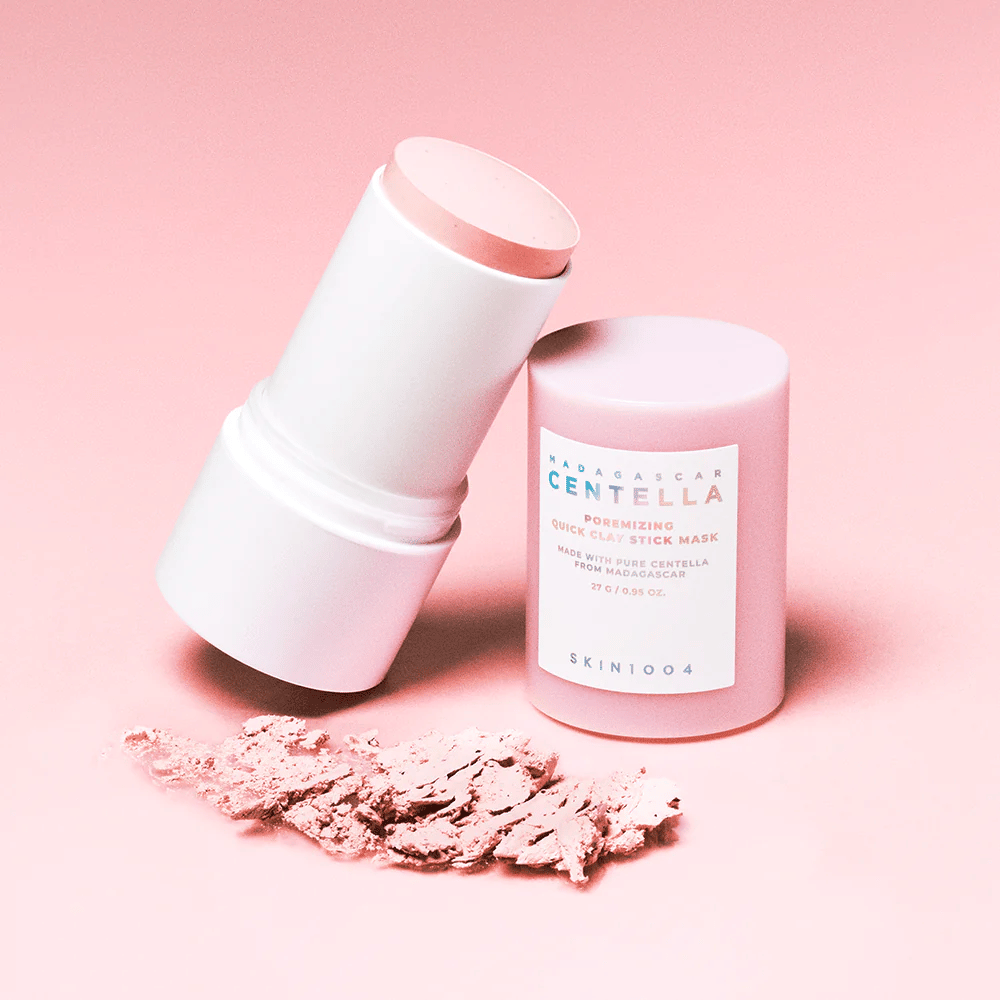 SKIN1004 Madagascar Centella Poremizing Quick Clay Stick Mask in a pink packaging. Practical clay mask in stick format to cleanse and minimize pores.