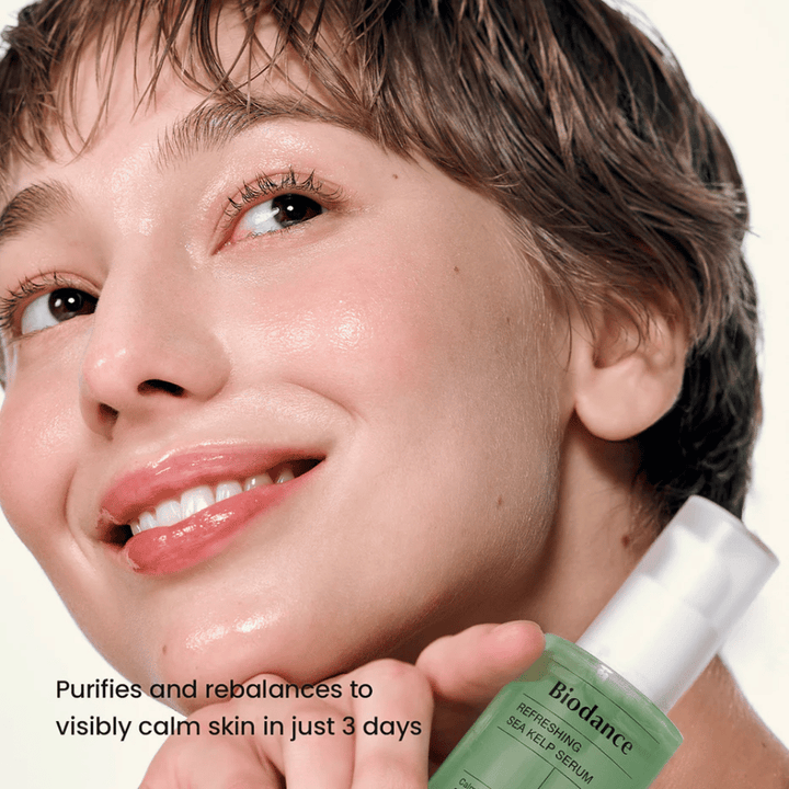 Woman with clear and balanced skin uses Biodance Sea Kelp Serum – visibly soothing effect.