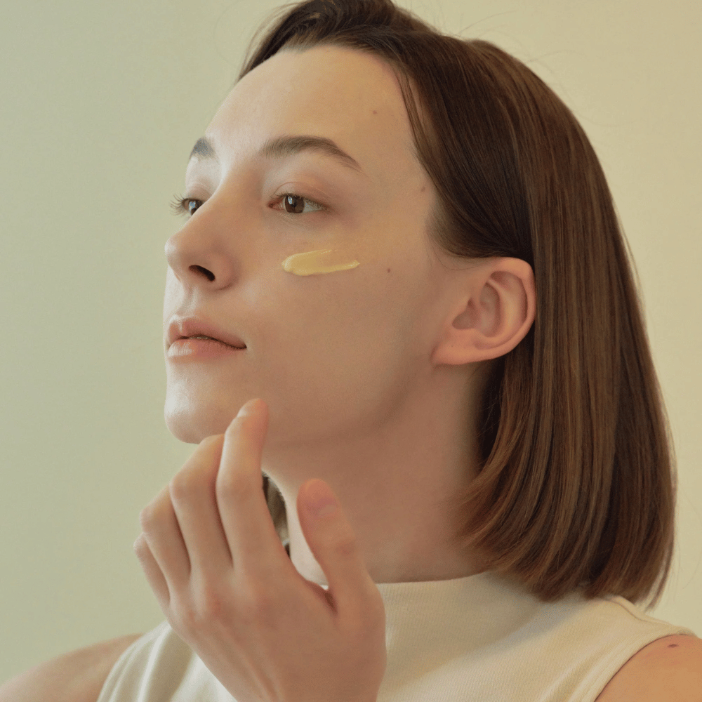 image of model applying Beauty of Joseon Revive Eye Serum under the eye – anti-age serum with ginseng and retinal.