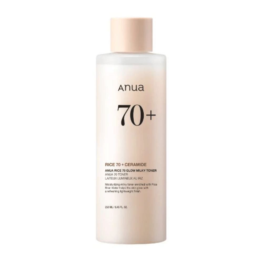 A bottle of "Anua 70+ Rice Ceramide Milky Toner". This toner is formulated to brighten and add radiance to the skin, enriched with rice water and ceramides. The packaging is simple and elegant with a soft beige tone and a discreet label.