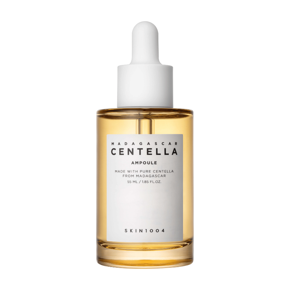 A glass bottle with a dropper cap from SKIN1004, Madagascar Centella Ampoule, with information about centella from Madagascar, against a white background.
