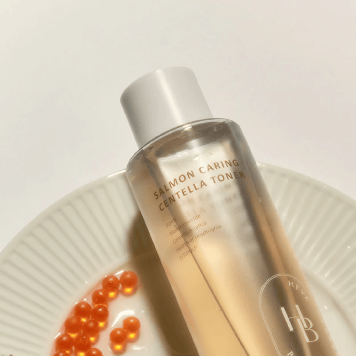 Salmon Caring Centella Toner from Heveblue with a salmon-inspired ingredient environment – Korean toner with PDRN and centella that soothes the skin, strengthens the skin barrier, and provides intensive hydration.