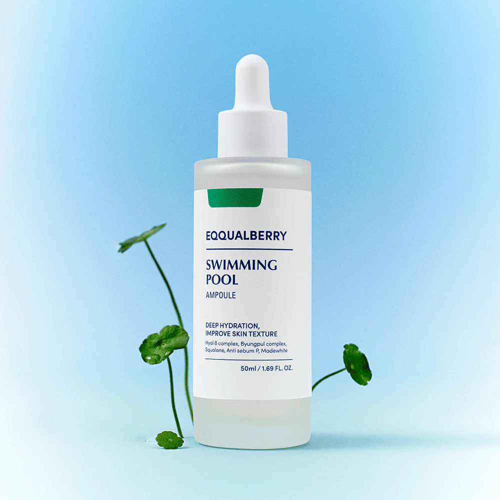 Bottle with Eqqualberry Swimming Pool Ampoule, a skincare product for deep hydration and improved skin structure, placed on a light blue background with some green plants in the foreground.
