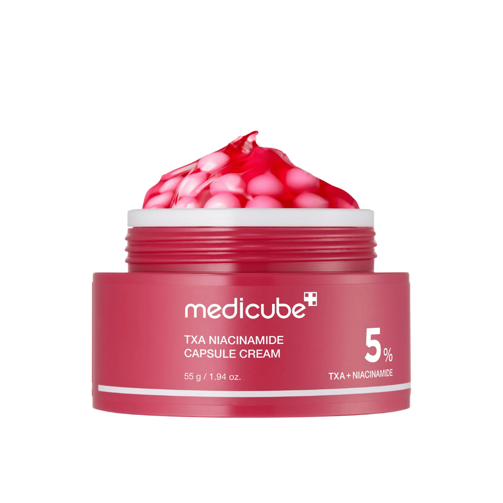 Medicube TXA Niacinamide Capsule Cream in a jar with pink gel capsules, showing clear product labeling with 5% TXA + Niacinamide.