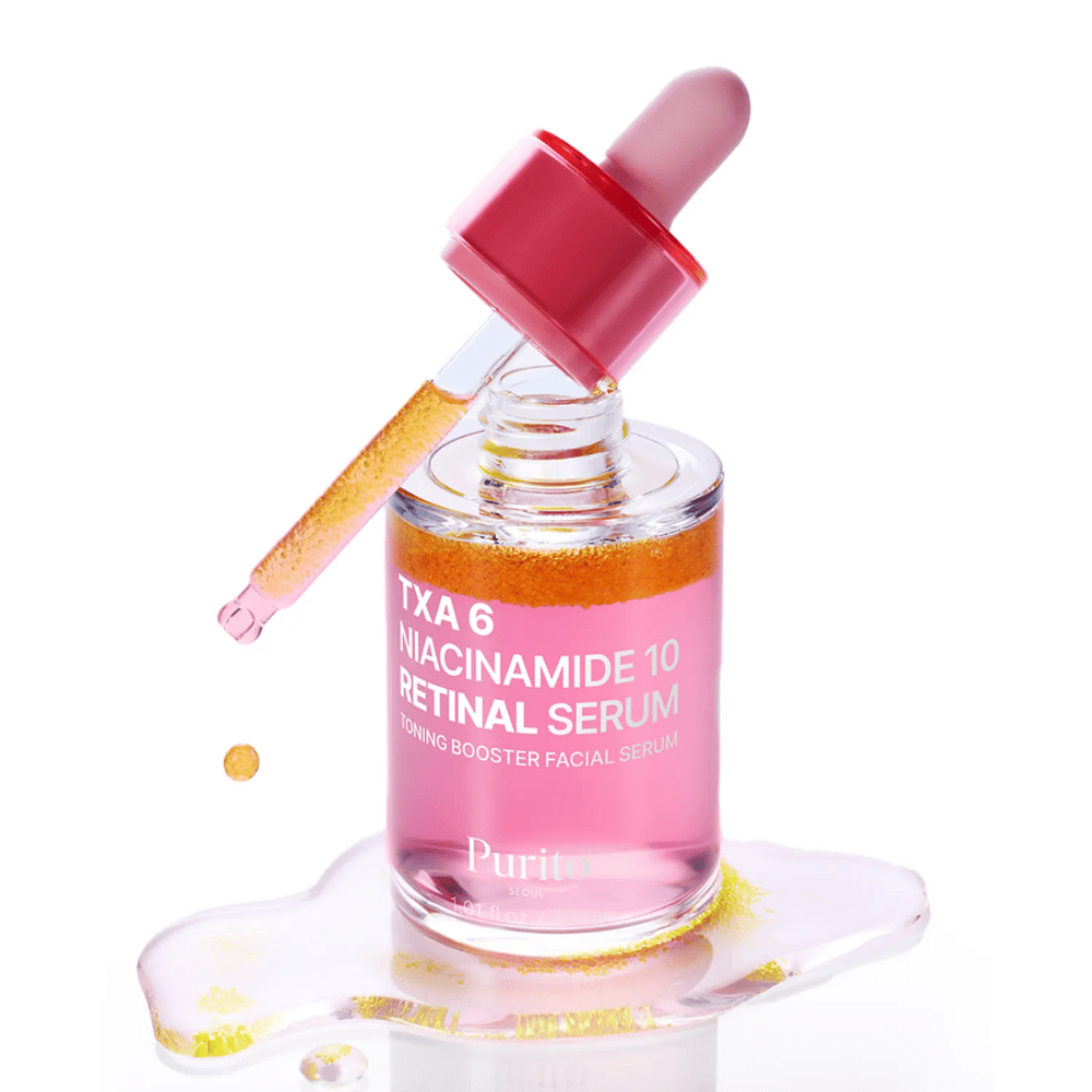 Purito TXA 6 Niacinamide 10 Retinal Serum – pink toning booster serum with pipette. Combines TXA, niacinamide, and retinal for even skin tone.