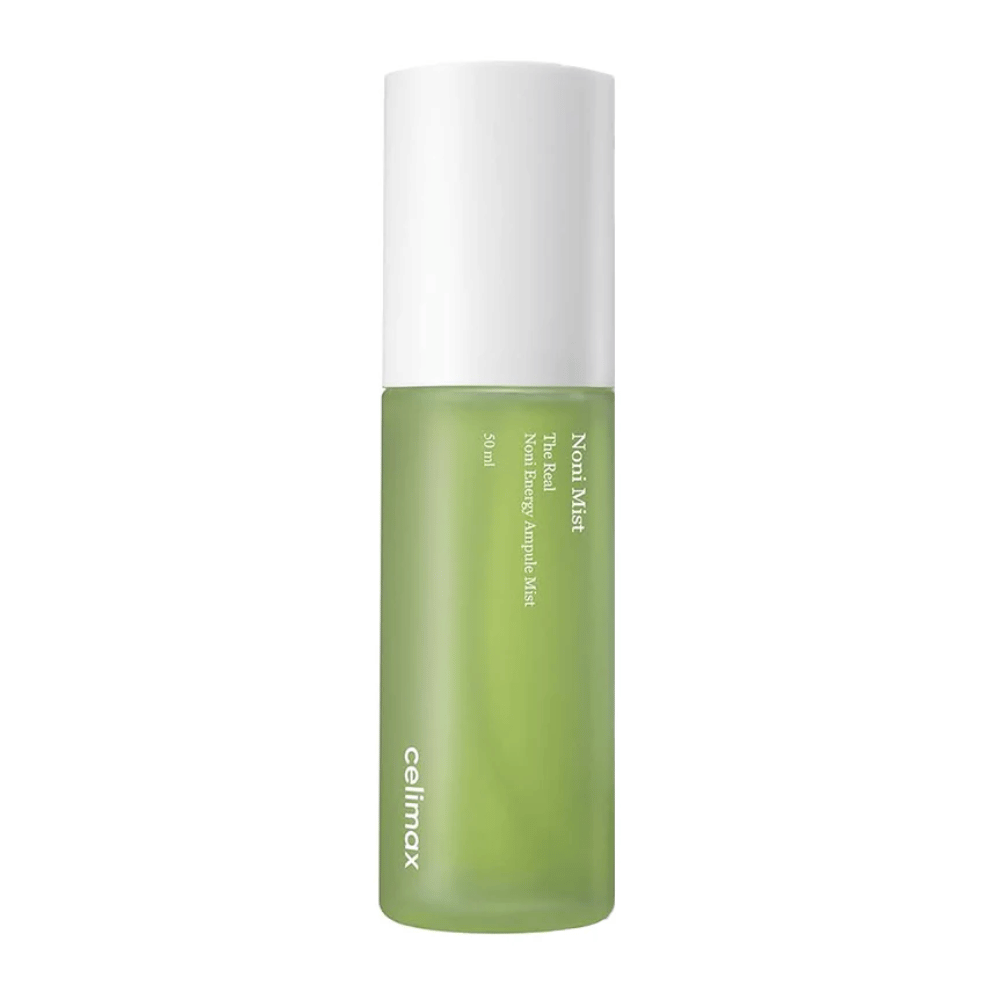 Celimax Noni Mist in a green bottle with a white cap. The product, "The Real Noni Energy Ampule Mist," has a capacity of 50 ml and is marketed to provide energy and hydration to the skin.