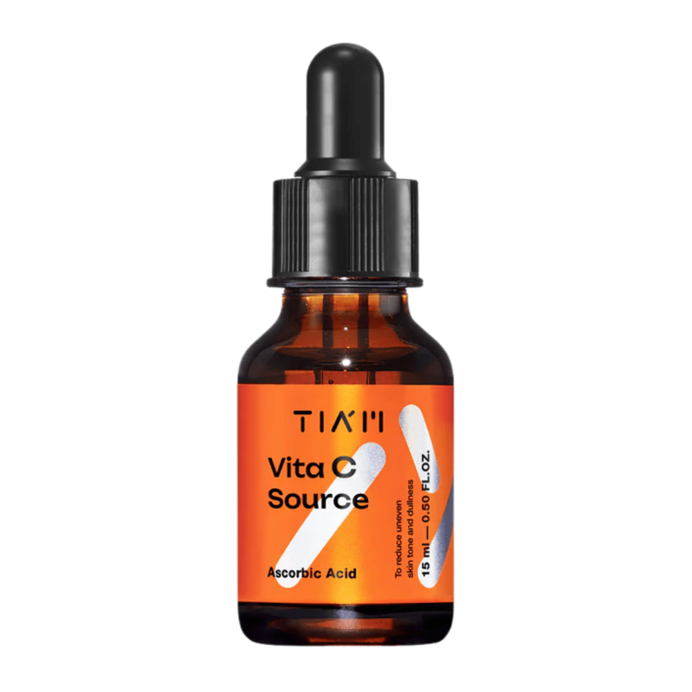 TIA'M Vita C Source, a serum with ascorbic acid in a brown glass bottle with a black pipette and orange label – effective for brightening the skin and reducing uneven skin tone.