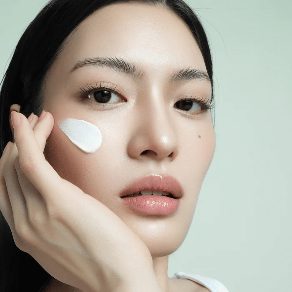 Model applies d’Alba Waterfull Mild Sun Cream SPF 50+ on the face. Light, moisturizing sun protection with mineral filter, perfect for daily use and sensitive skin.