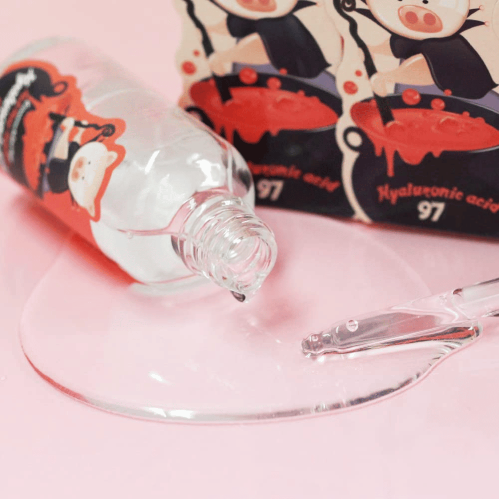 Close-up of Elizavecca Hyaluronic Acid 97 with pipette and clear serum texture that absorbs quickly and deeply hydrates the skin.