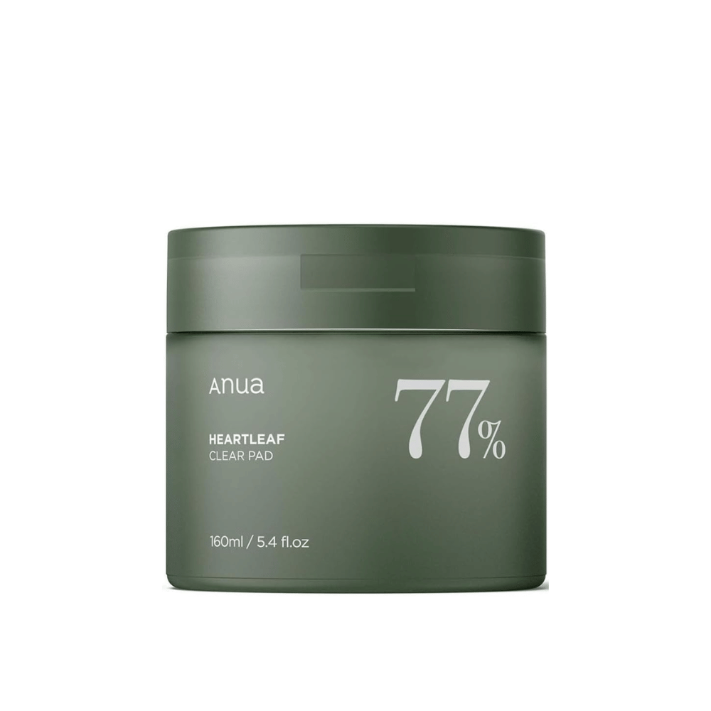 A green container with the skincare product Anua Heartleaf Clear Pad, highlighting 77% on the label, against a solid-colored background.