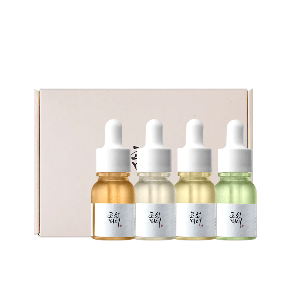 A box with three bottles Hanbang Serum Discovery Kit 4 pcs from Beauty of Joseon, each promoting a youthful glow and reducing wrinkles.