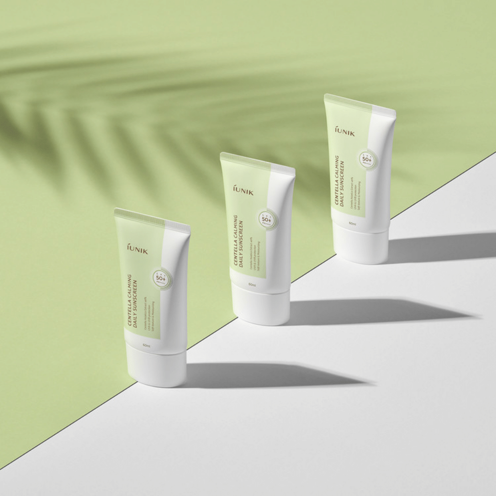 Three tubes iUNIK Centella Calming Daily Sunscreen with SPF 50+ protection against UVA and UVB rays on a white background.
